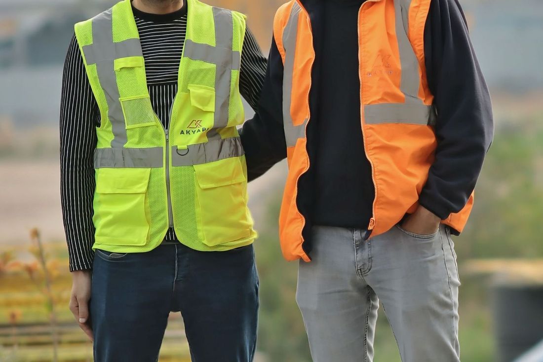 Crew members in safety gear on a job site
