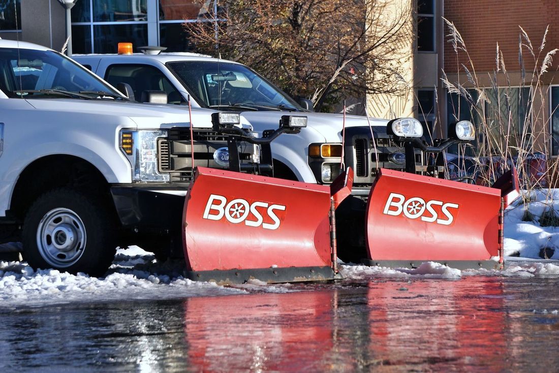 Plow trucks staged and ready before a winter storm