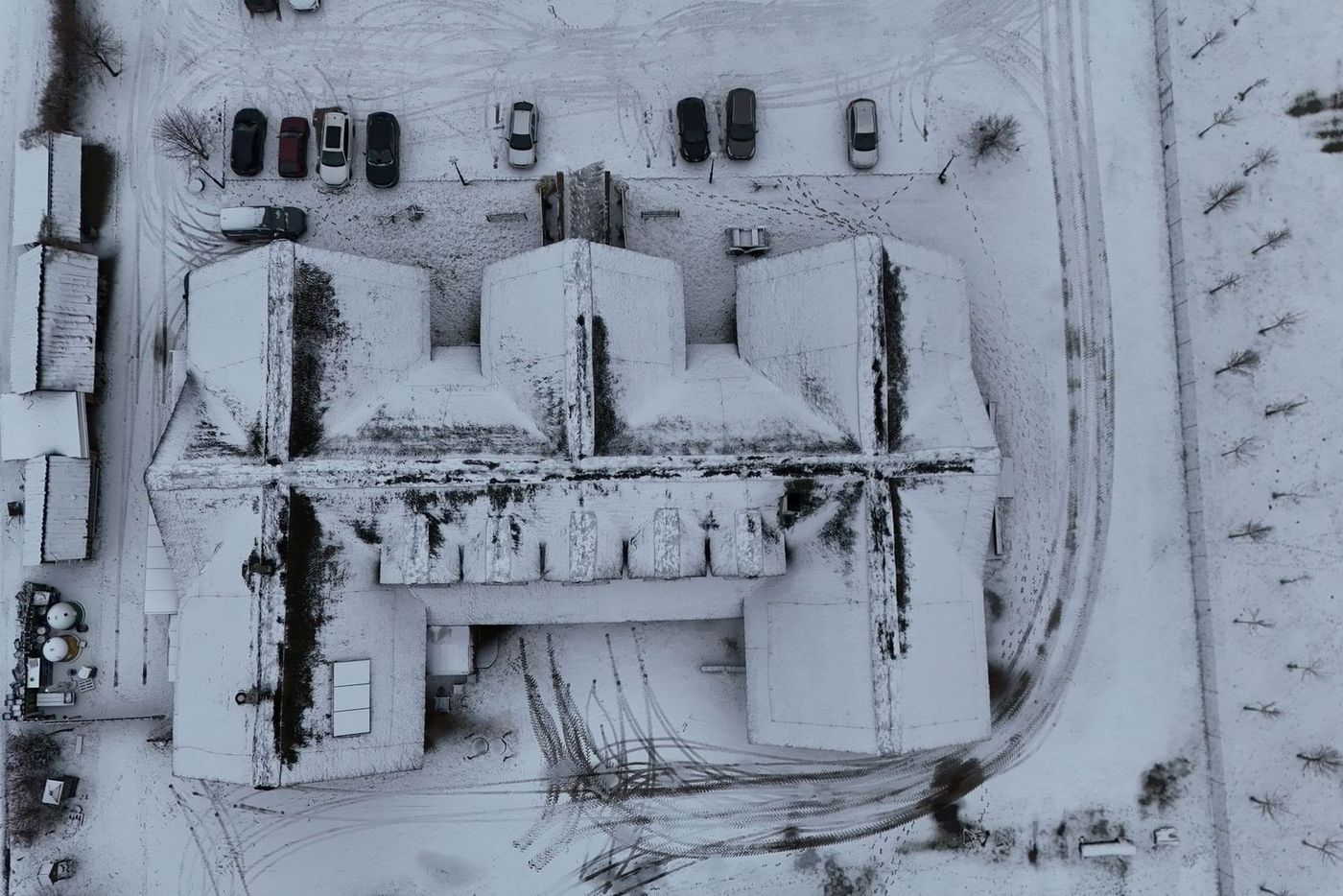 Loader clearing a large commercial lot after a snowfall