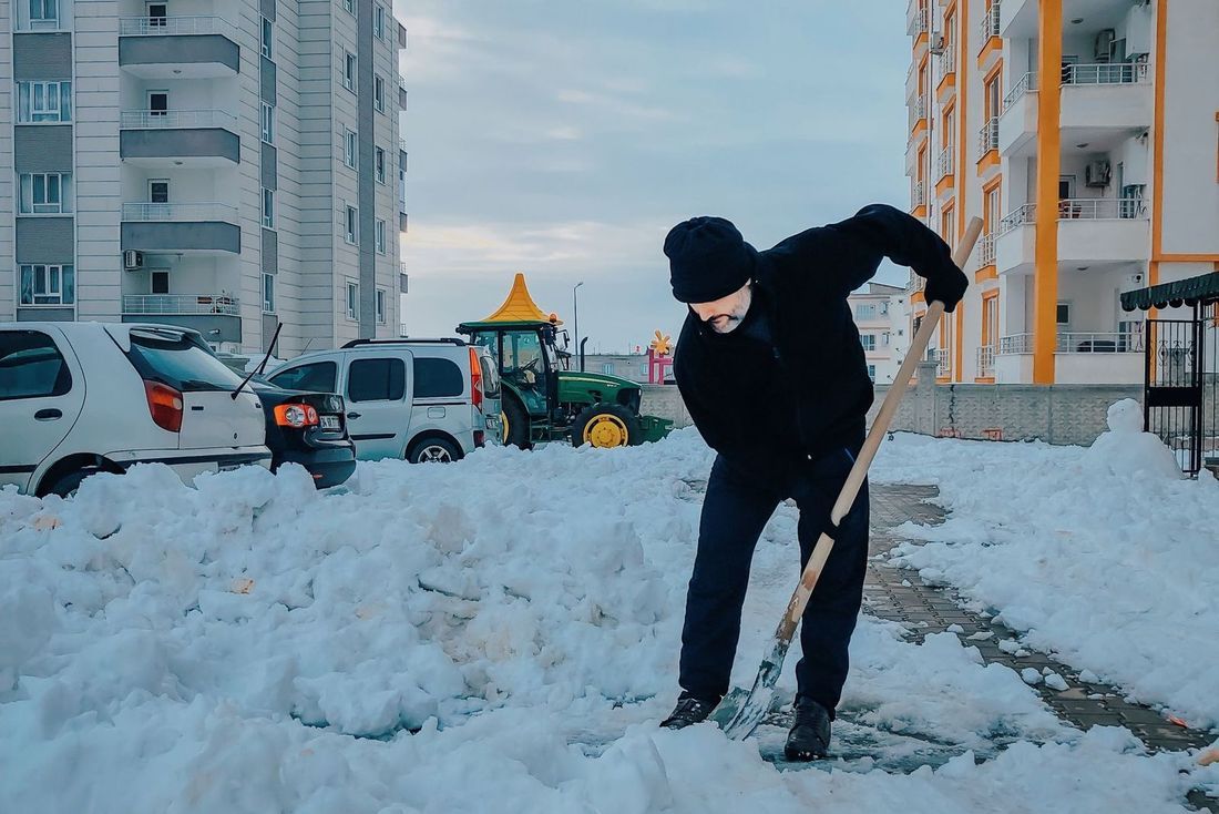 Crew clearing a commercial sidewalk after a snowfall